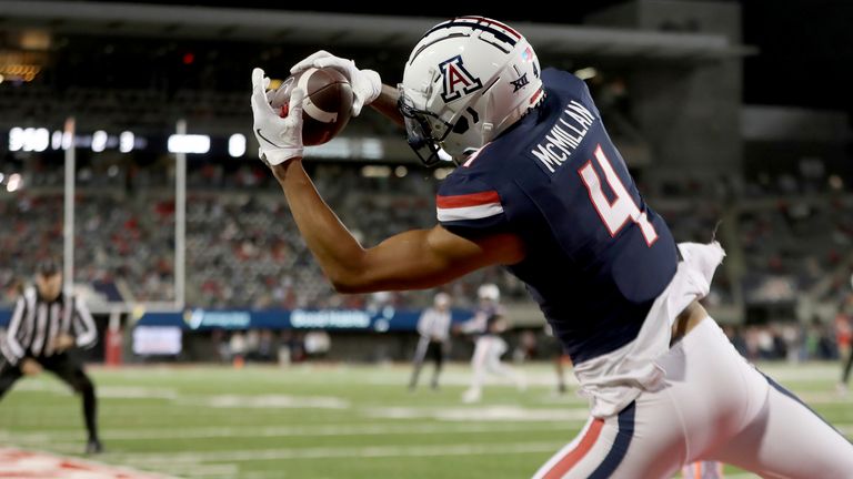TUCSON, AZ - NOVEMBER 15: Arizona Wildcats wide receiver Tetairoa McMillan #4 catches the ball but is unable to remain in bounds during a football game between the University of Houston Cougars and the University of Arizona Wildcats. November 15, 2024 at Arizona Stadium in Tucson, AZ. (Photo by Christopher Hook/Icon Sportswire) (Icon Sportswire via AP Images)