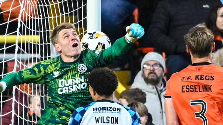 Dundee United's Yevhen Kucherenko mispunched the ball into his own net against Falkirk
