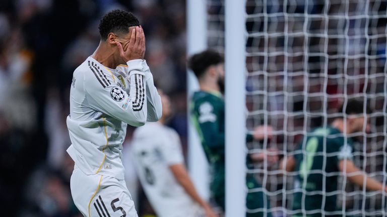 Real Madrid's Jude Bellingham reacts after missing a chance during a Champions League opening phase soccer match between Real Madrid and Manchester City, in Madrid, Spain, Wednesday, Dec. 10, 2025. (AP Photo/Manu Fernandez)